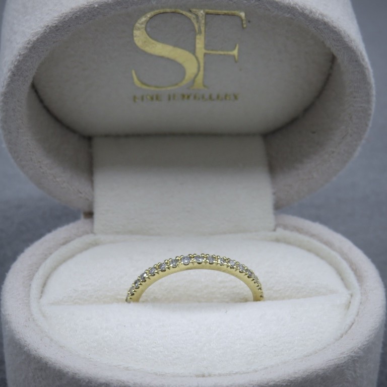 Yellow gold and diamond ring in a box