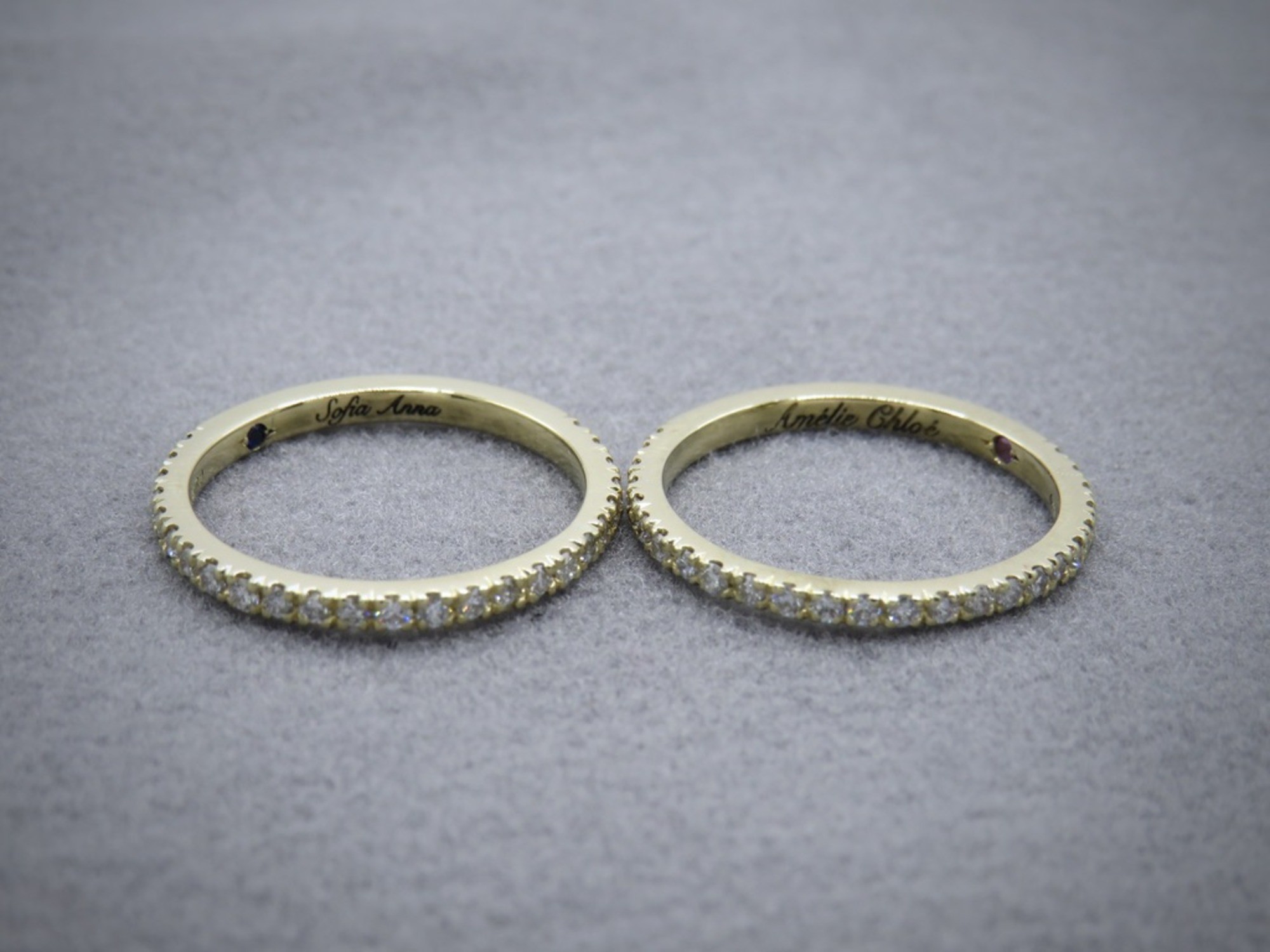 Two half diamond and yellow gold eternity rings